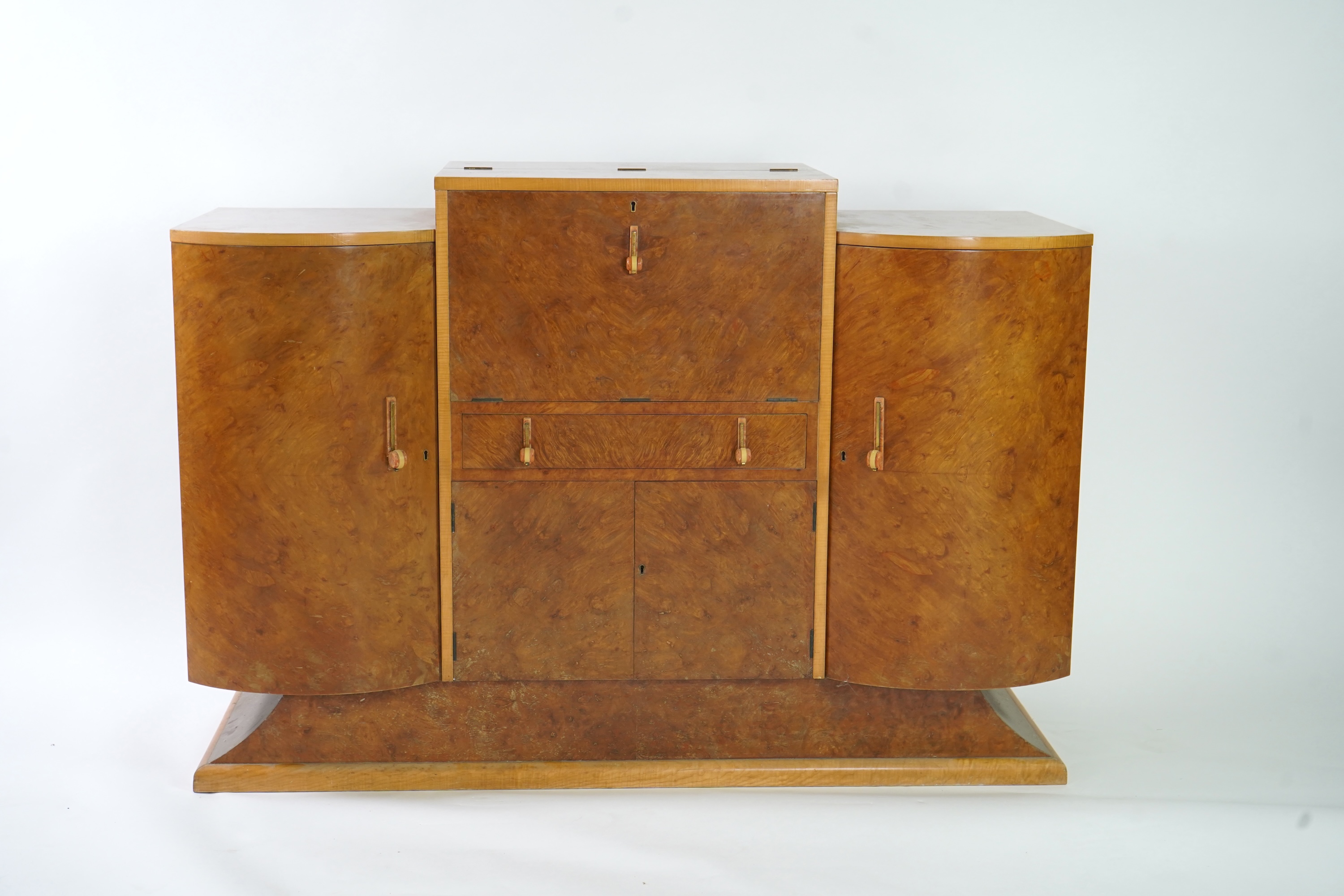 Attributed to Harry and Lou Epstein: An Art Deco burr walnut dining suite